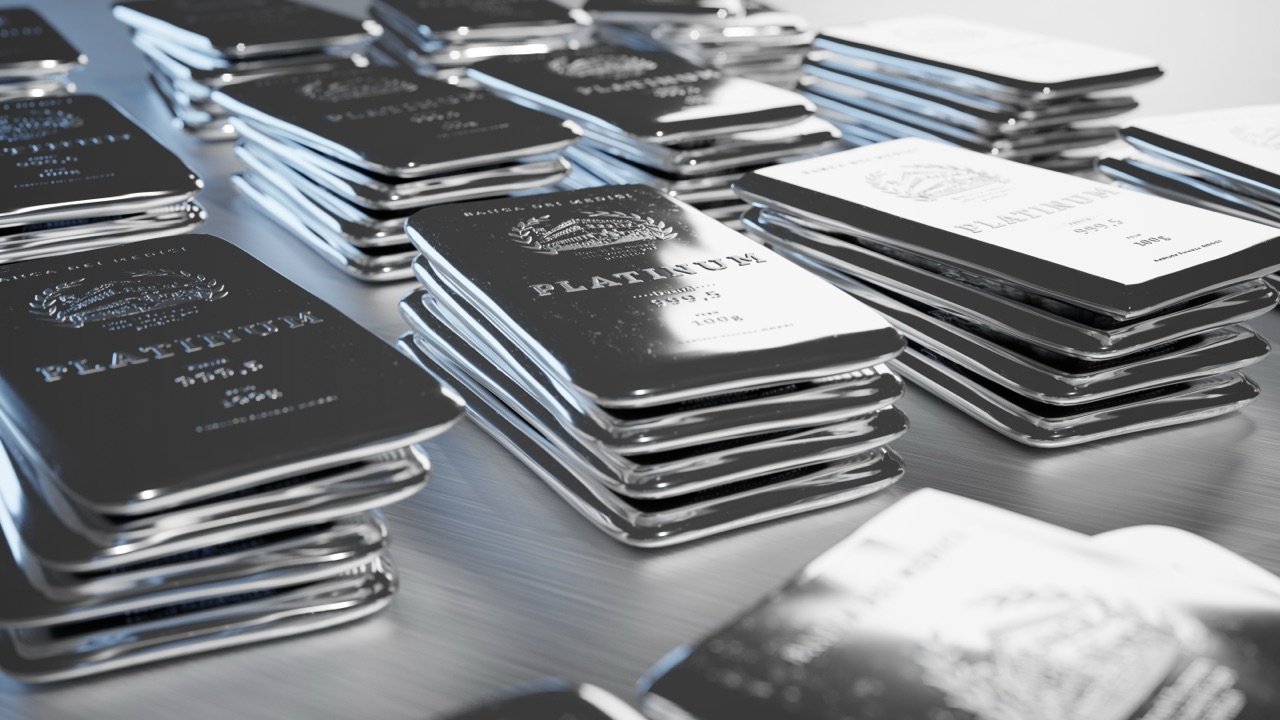 Stacked rows of cast platinum bullion bars stamped 999.5 fine.