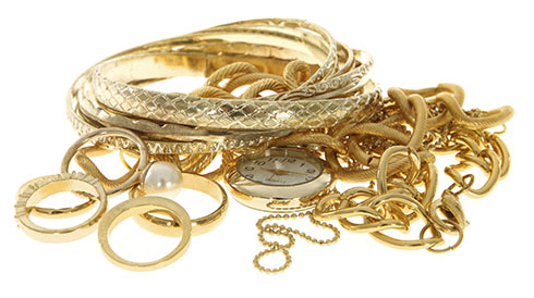 Various gold jewelry items like bracelets, necklaces, and rings.